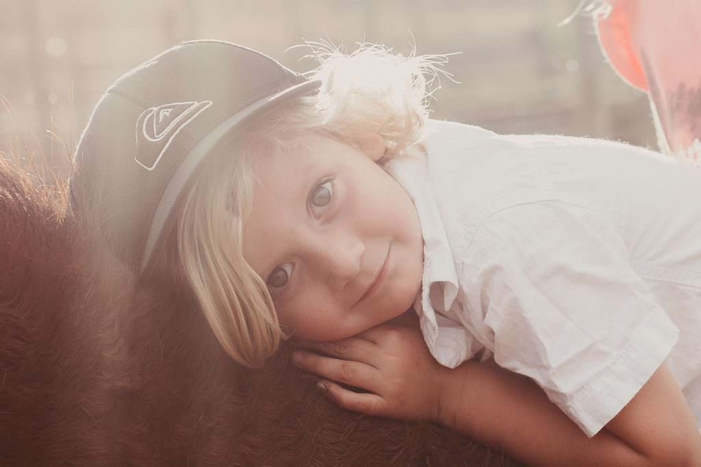 a boy with big blue eyes, blonde hair loves having his photograph taken by Quirindi family photographer Karissa Tuckwell