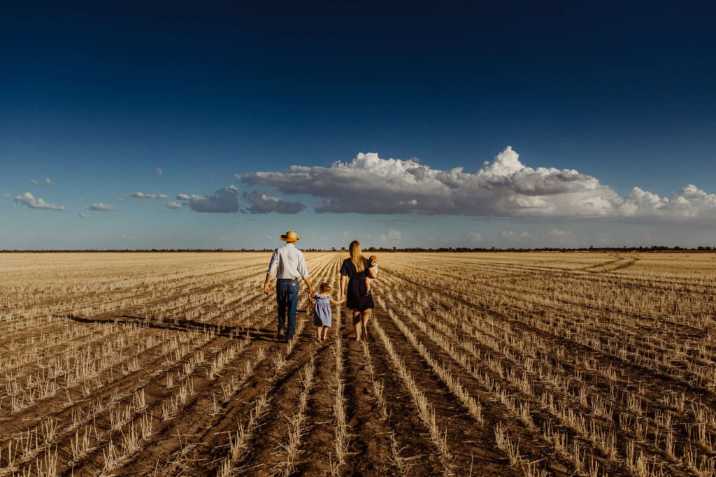 family photography in country QLD the wheat is golden and has been harvested