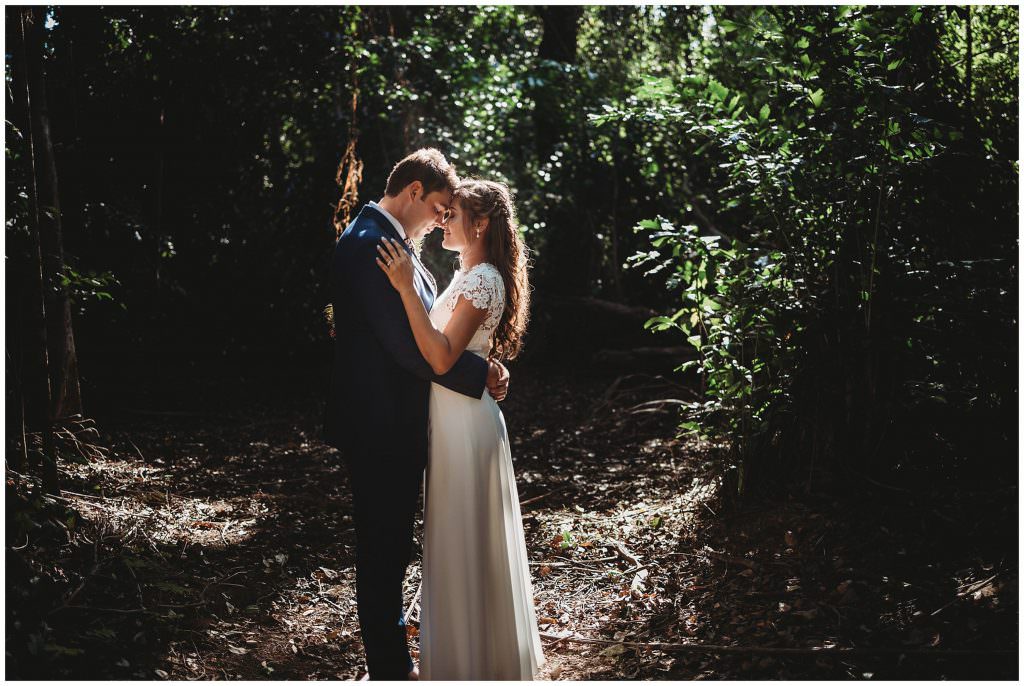 wedding photos in the middle of the day can still be amazing. green trees rainforest