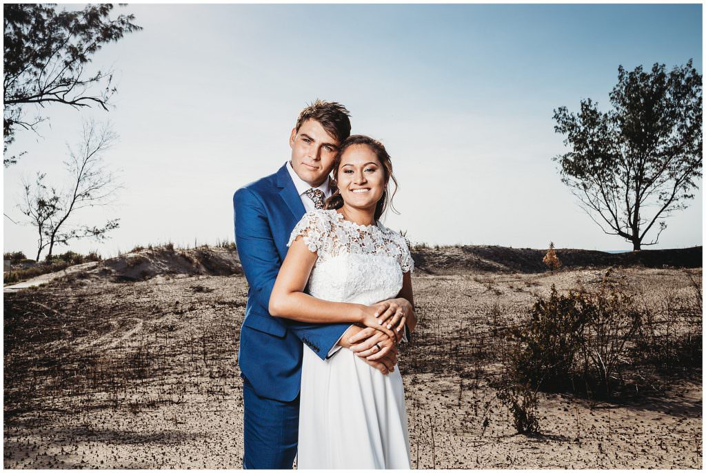 burnt grass heads with a bride and groom at Casuarina beach sand dunes