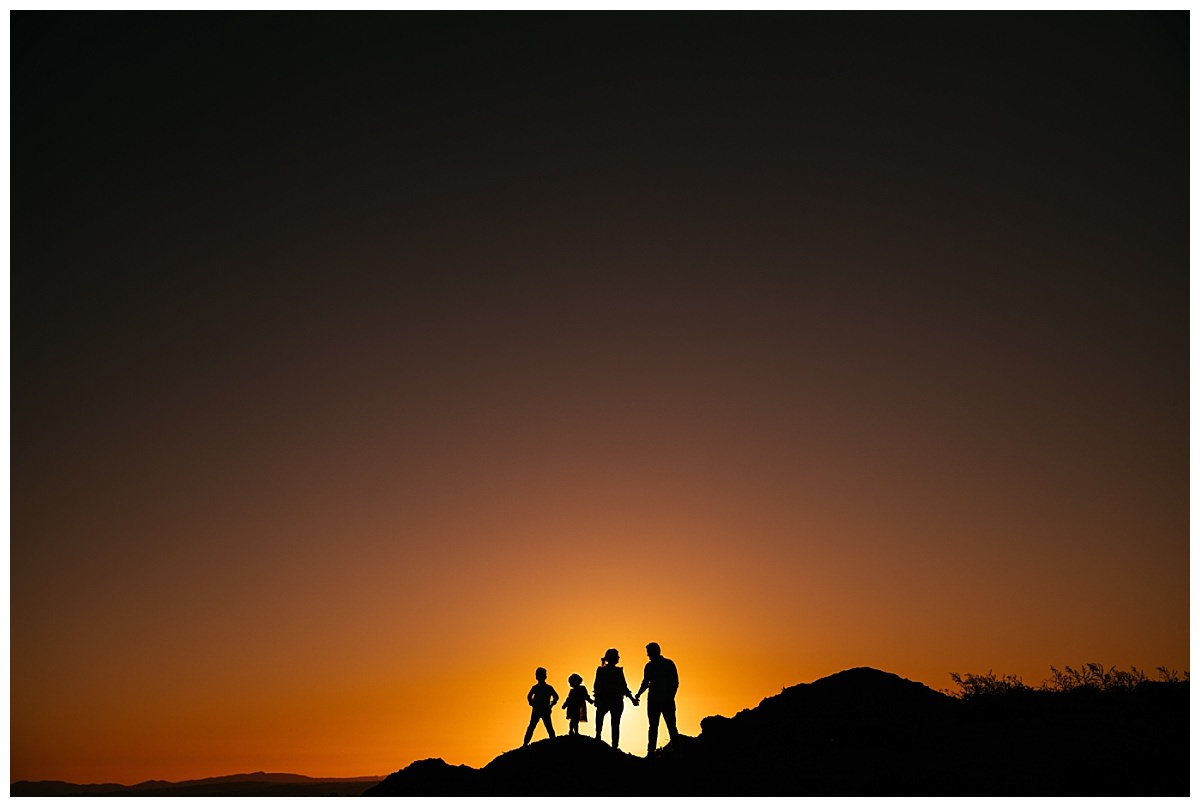 family of four on a hill silhouette as the Tamworth sun sets