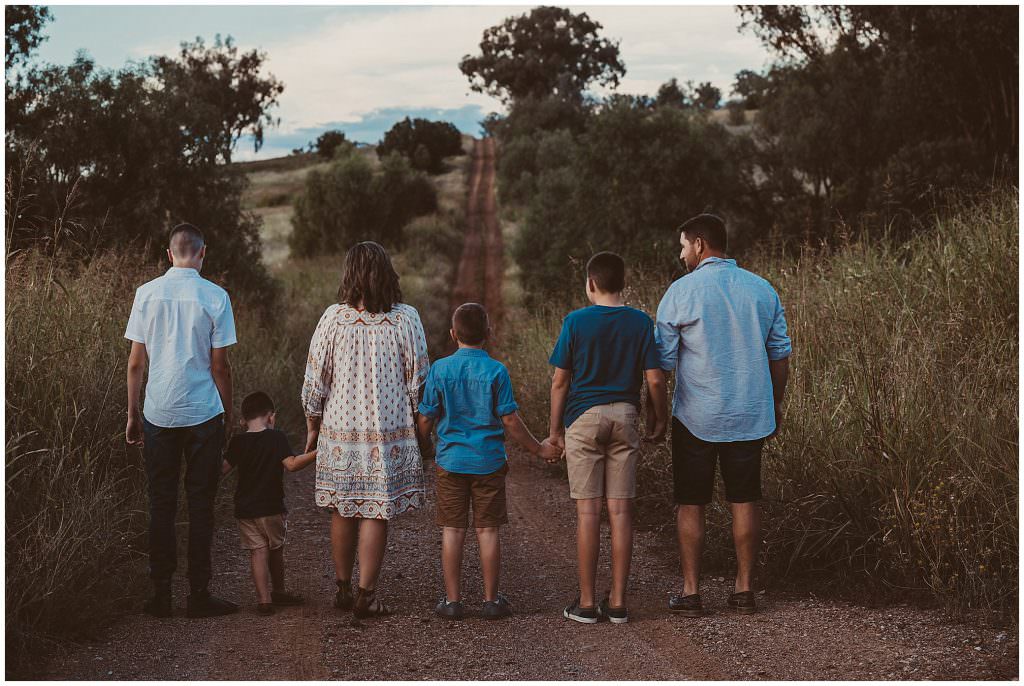 walking away a family of six walk a country lane
