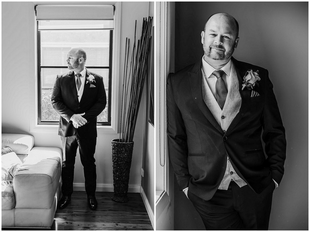 a groom in black and white prepares for his wedding