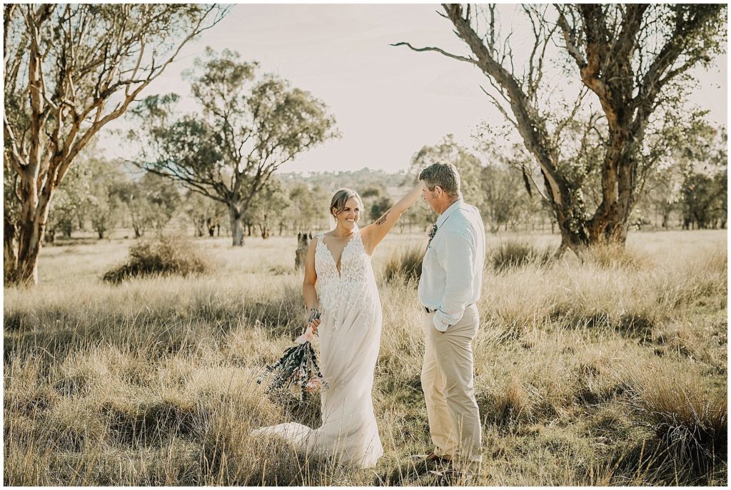 wedding photos as a couple dances at Dathem park woolshed