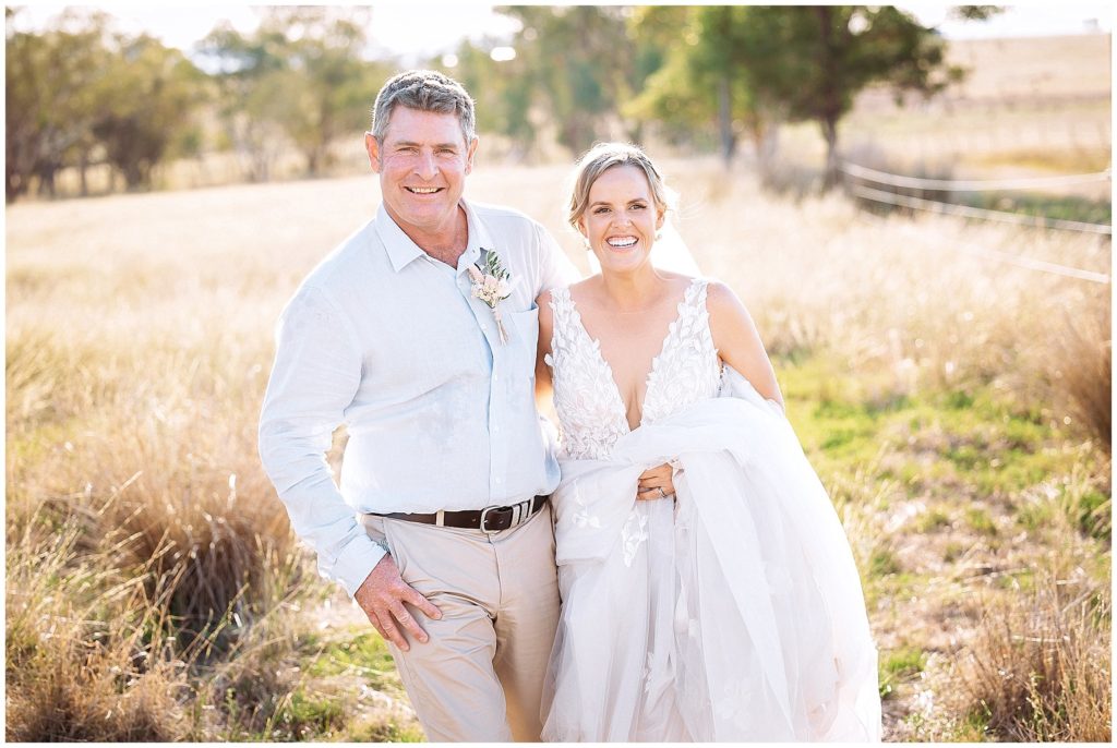 wedding photos run in the long grass at Dathem park woolshed