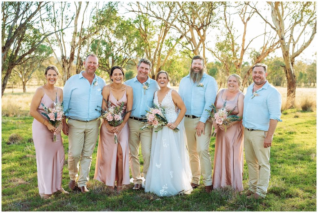 wedding photos run in the long grass at Dathem park woolshed