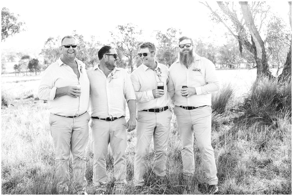 wedding photos in the long grass at Dathem park woolshed