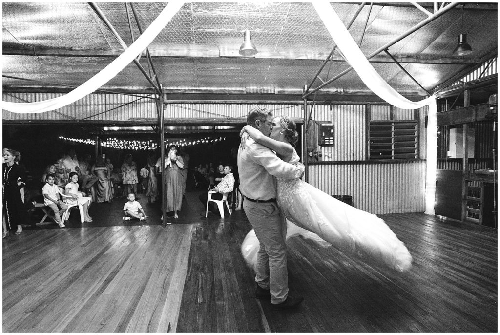 Dathem park wedding reception venue a bride & groom have their bridal waltz under the chandelier as they spin