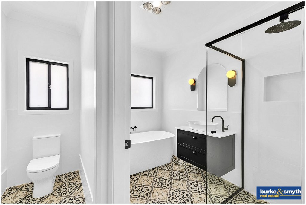 bathroom with black fixtures & patterned tiles in TAMWORTH NSW