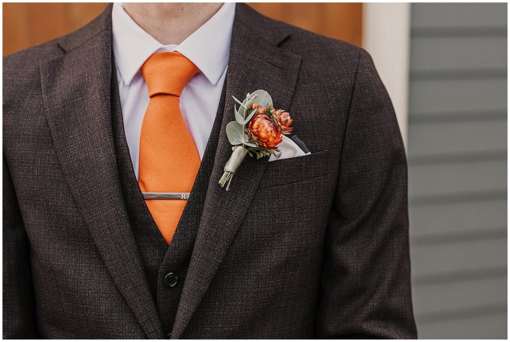 grooms and his yellow tie and button hole flowers by Rosemerin Armidale florist
