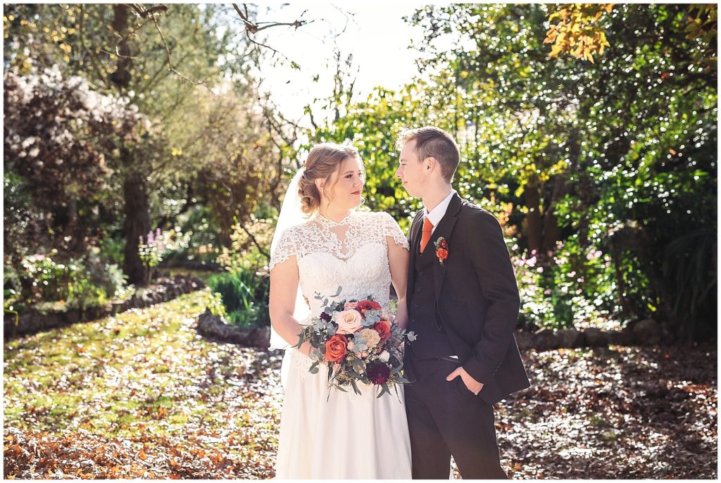 sunlight and bride and groomas they blook at each other