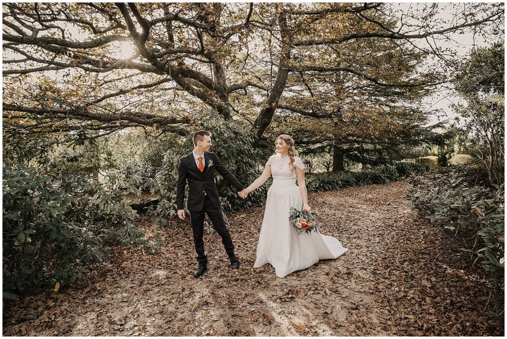 Rock Abbey reception venue as a bridal couple walk and talk