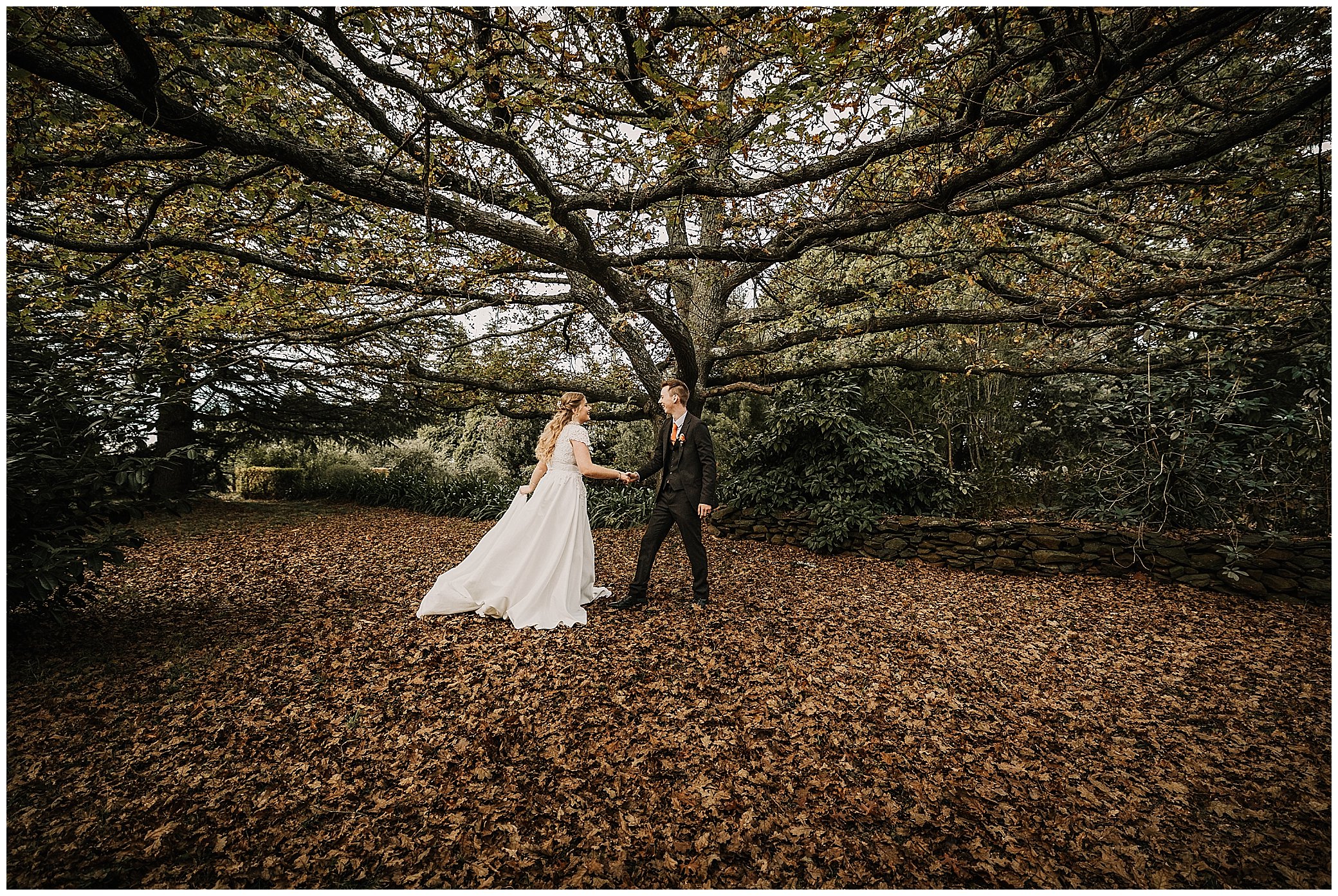 dancing couple under a big oak tree at rock abbey gardens Uralla