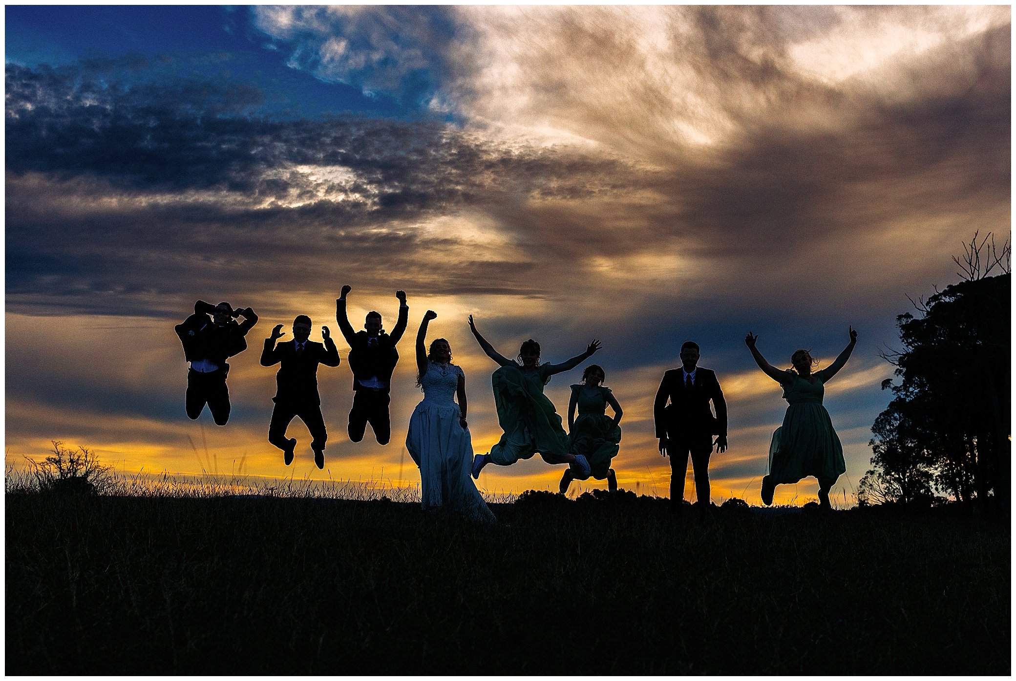 sunsets & poses and jump shot as a bridal party leap in the air uralla nsw