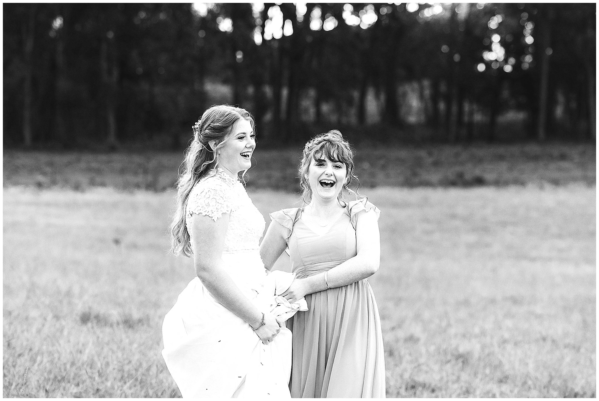 a bride and her sister black and white photo laugh near Armidale NSW