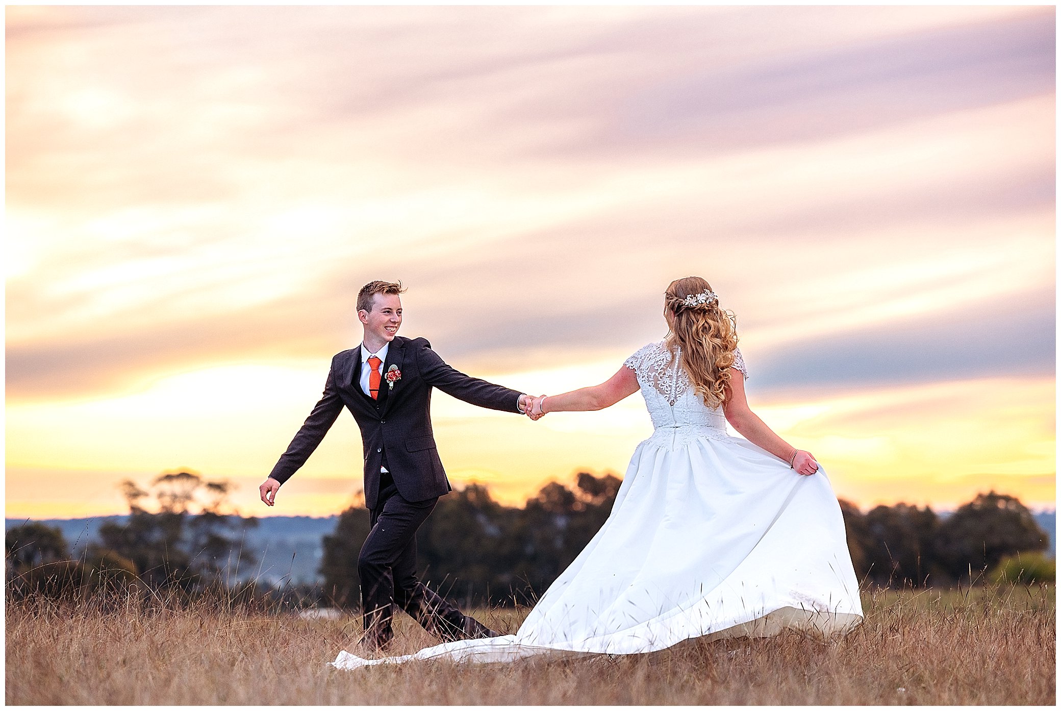 rock abbey gardens paddock as the sunset for location wedding photos as a couple spin. the bride holds her dress out