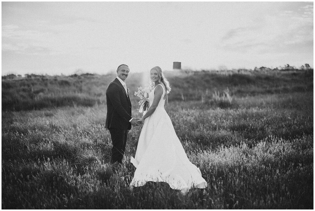 a black and white photo as a coupe look back at the camera