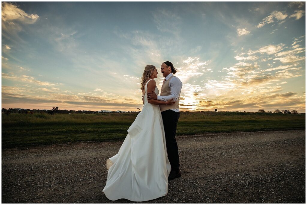 a Tangarratta sunset as a couple look at each other on their wedding day